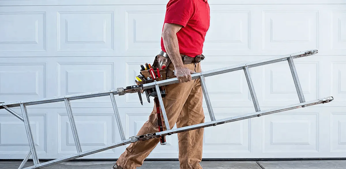 Garage door repair technician arriving with tools and ladder in Oakland, CA